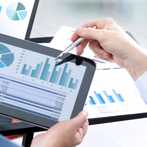 Business colleagues analyzing figures on tablet